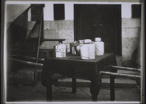 Chinese dowry carried along quite publicly with the bride. Containers made of metal and tin, carpet and table