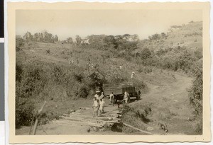 Ethiopian men and truck crossing bridge near Bube, Ethiopia, 1952