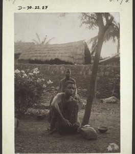 African sharpening a knife