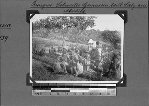 Mathilde Gemuseus distributes salt to the congregation, Rungwe, Tanzania, 1931