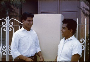 Two men in front of church of Christ building