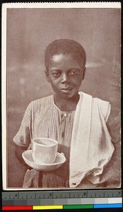 Young boy holding cup and towel, Congo, ca.1920-1940