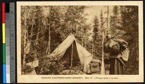 Catholic bishop standing outside of a tent in a forest, Canada, ca.1920-1940