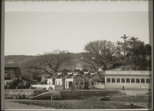 Local temple and school (view from the new mission house)