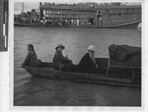 Priests on a small boat at Jiangmen, China, 1947