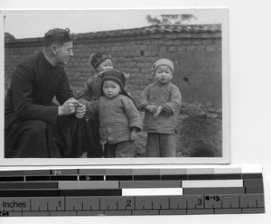 Rev. Lacroix with three children at Bantian, China,1938