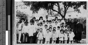 Group portrait of Maryknoll Sisters and orphans, Loting, China, ca. 1936