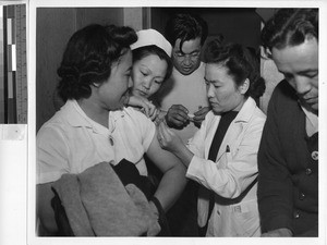 Smallpox vaccination, Santa Anita Park, Arcadia, Calif., July 1942