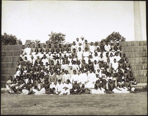 (Tile-works .... Group photo on piled-up bricks and tiles.)