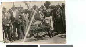 Man showing the underneath of a xylophone, South Africa