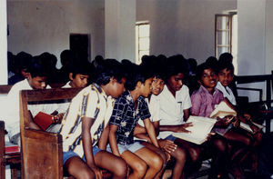 East Jeypore, Orissa, India. Worship at Gunupur Church. Some of the hostel boys are sitting at