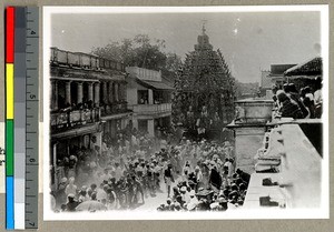 Juggernath temple pulled in a crowded street, Vārānasi , India, ca. 1920