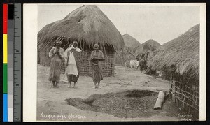 People standing amid stick huts, Sudan, ca.1920-1940