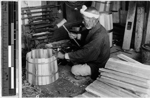 Japanese cooper assembling a bucket, Japan, August 1932