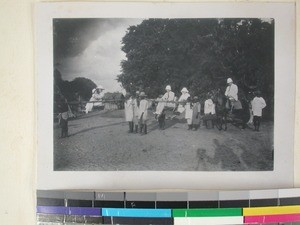 Travelling companions in carrying chairs and on a horse, Andranomena, Madagascar, 1922