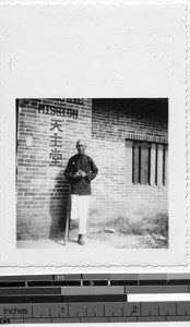 Man in front of building, Lipu, China, 1945