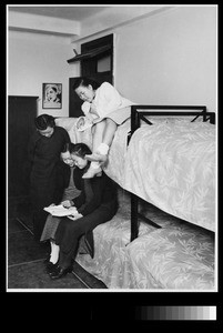 Four students in their dormitory room , Women's College, Yenching University, Beijing, China, 1941