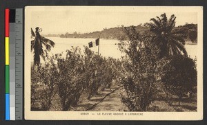 French tricolor flying at lake's edge, Gabon, ca.1920-1940