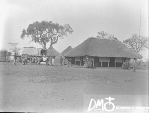 Group of people in front of huts, Limpopo, South Africa, ca. 1896-1911