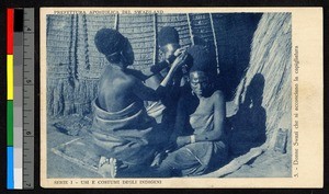 Women arranging their hair, Swaziland, 1939