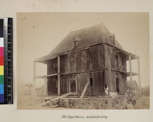 Men sitting outside old Royal House, Ambohidrabiby, Antananarivo, Madagascar, ca.1865-1885