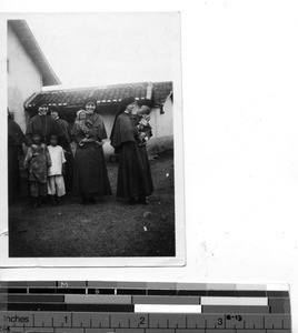 A Maryknoll Sisters with children, Christmas day at Dongshi, China, 1934