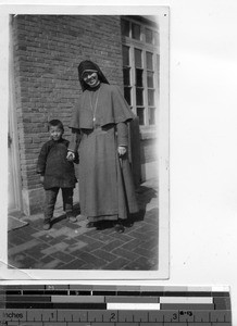 Maryknoll Sister with a child at Fushun, China