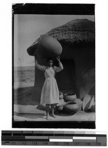 A girl carrying a clay pot, South Africa East