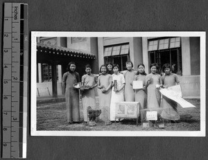 Refugee girls displaying the poultry they raised, Ginling College, Nanjing, China, ca.1937-1938