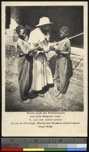 A net knitting lesson, Congo, ca.1920-1940