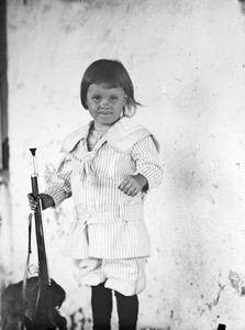 European child with a toy gun, Tanzania, ca.1897-1920