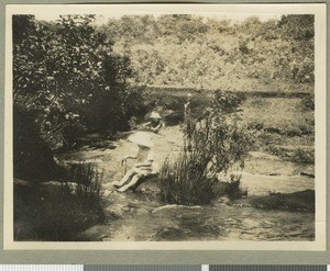 Children playing in a stream, Chogoria, Kenya, ca.1925