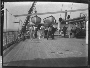 Men playing a game on a ship, Africa, ca. 1901-1907