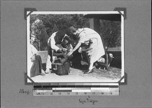 Missionary Giersch administers eye-drops, Mbozi, Tanzania, ca.1927-1929