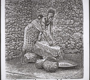 African woman grinding maize