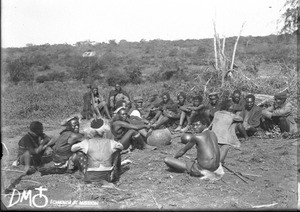 African men drinking beer during a wedding, Makulane, Mozambique, 1909