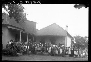 African people sheltering from the rain, Mozambique, Pentecost 1936