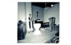 Pastor Richard Madsen at the baptismal font and altar party in the sydarabiske Church. This pic