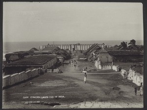 "Cape Cormorin, the southernmost tip of India. Temple buildings. This is the place where the sun rises from the sea, and sinks back into the sea in the evening - a rare sight."