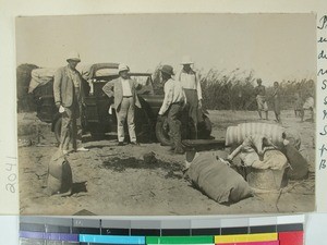 Automobile and passengers on the river side, Belo sur Tsiribihina, Madagascar, 1928