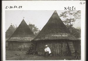 Huts in Nyasoso. On the left pottery for someone who had died