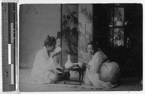 Korean man and woman eating a meal, Korea, ca. 1920-1940