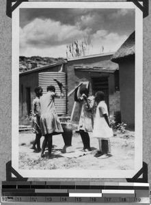 School girls mashing maize, South Africa East