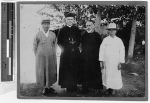 Father Cleary with three men, Gishu, Korea, 1924