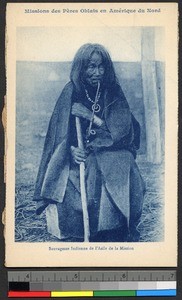 Elderly woman seated with pipe, Canada, ca.1920-1940