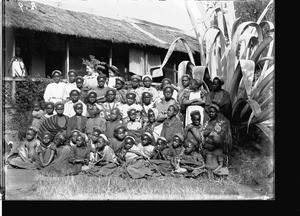 African girls in front of a building with a thatched roof, Limpopo, South Africa, ca. 1900