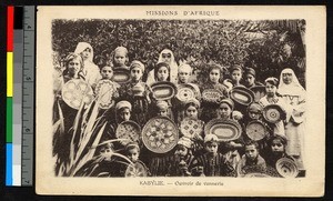 Missionary sisters with women holding bowls, Algeria, ca.1920-1940