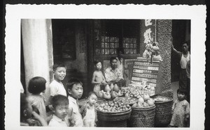 A shop selling fruit and cigarettes on the street