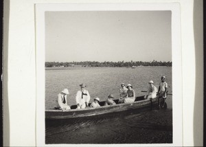 Missionaries in a boat with Professor Schlunk