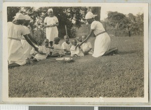 Nurses feeding children, Chogoria, Kenya, ca.1940